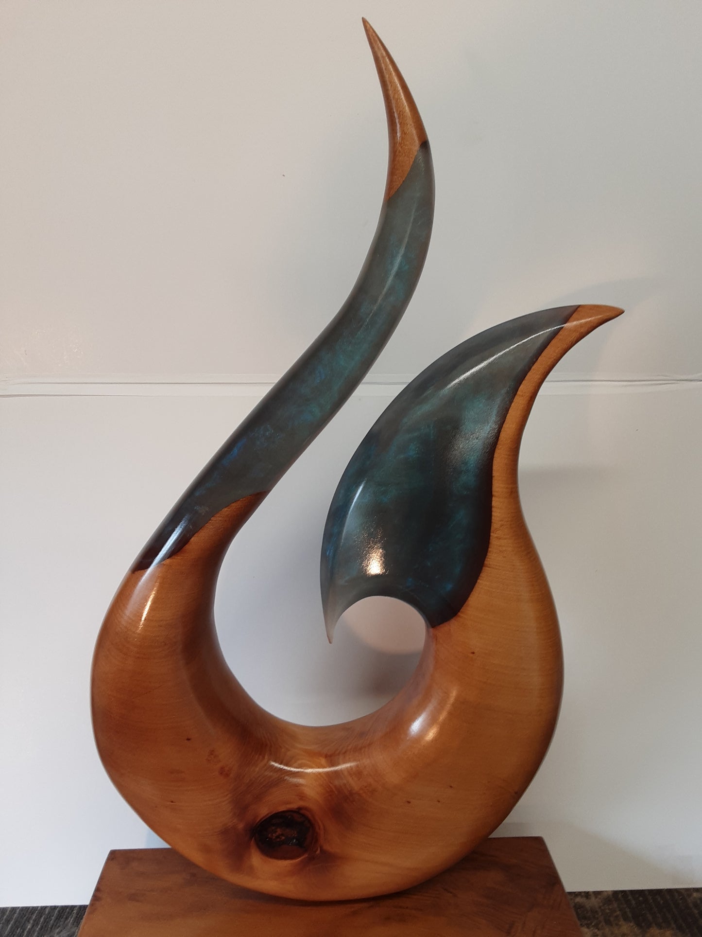 Kauri and resin hei matau sculpture