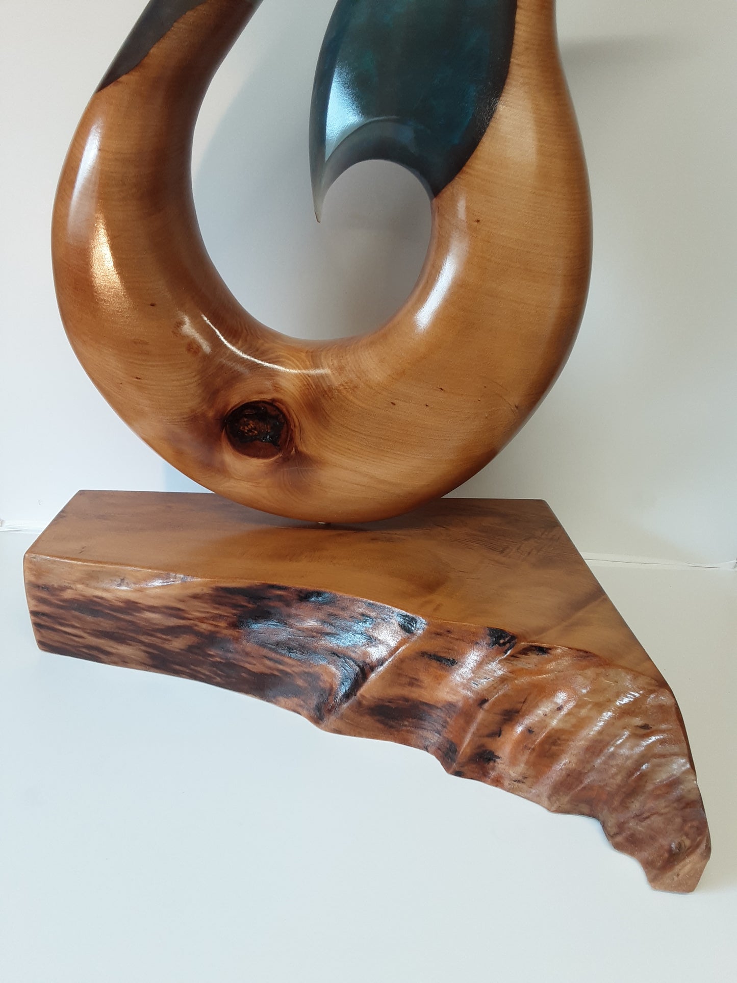 Kauri and resin hei matau sculpture